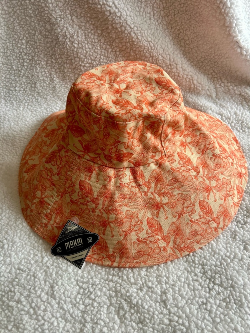 Makai brand bucket hat featuring a floral print one size New